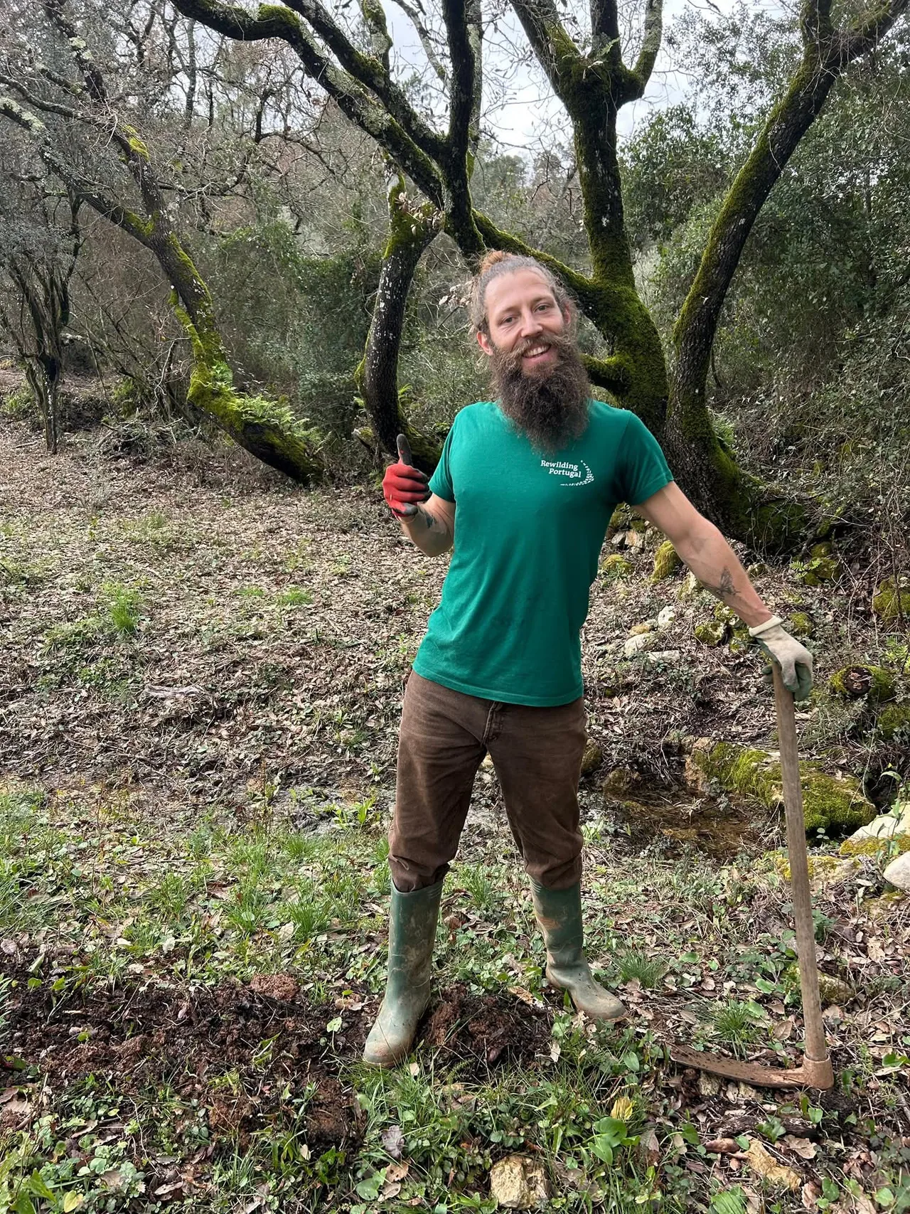 Benjy outdoors with tools in a wooded landscape
